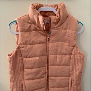Light salmon colored vest